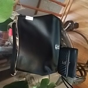 Victoria secret large purse , black leather gold finish, and black inside